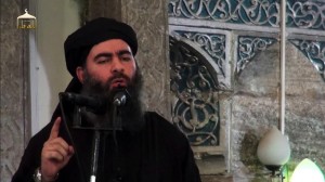 An image grab taken from a propaganda video released on July 5, 2014 by al-Furqan Media allegedly shows the leader of the Islamic State (IS) jihadist group, Abu Bakr al-Baghdadi, aka Caliph Ibrahim, adressing Muslim worshippers at a mosque in the militant-held northern Iraqi city of Mosul. Baghdadi, who on June 29 proclaimed a "caliphate" straddling Syria and Iraq, purportedly ordered all Muslims to obey him in the video released on social media.    AFP PHOTO / HO / AL-FURQAN MEDIA  == RESTRICTED TO EDITORIAL USE - MANDATORY CREDIT "AFP PHOTO / HO / AL-FURQAN MEDIA " - NO MARKETING NO ADVERTISING CAMPAIGNS - DISTRIBUTED AS A SERVICE TO CLIENTS FROM ALTERNATIVE SOURCES, AFP IS NOT RESPONSIBLE FOR ANY DIGITAL ALTERATIONS TO THE PICTURE'S EDITORIAL CONTENT, DATE AND LOCATION WHICH CANNOT BE INDEPENDENTLY VERIFIED == / AFP PHOTO / AL-FURQAN MEDIA / -