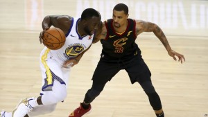 Golden State Warriors forward Draymond Green (23) drives against Cleveland Cavaliers guard George Hill (3) during the second half of Game 1 of basketball's NBA Finals in Oakland, Calif., Thursday, May 31, 2018. (AP Photo/Ben Margot)